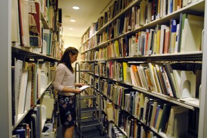 An intern in the Hirshhorn Library stacks.