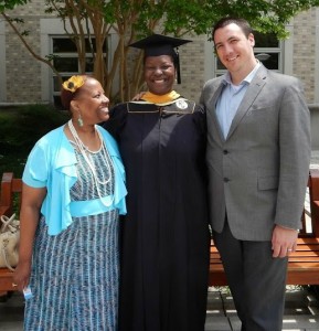 Salima poses with her mother and husband at her graduation from Catholic University.