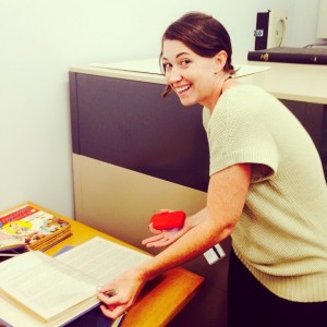 2014 Professional Development intern Kelly Baxter with Wonder Woman  manuscript materials.