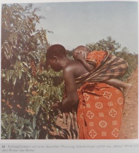 Coffee picker on a German plantation. The “mtoto” (child) sleeps unconcerned on the back of his mother. [Tanzania]