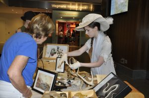 Melinda McCalley as Mary Anning discussing specimens