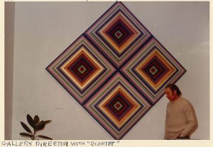 Photo of Harriet FeBland wall relief "Quartet" at "Women in Art" exhibition with director Denedict Goldsmith, Brainerd Art Gallery Museum, State University of New York, 1972