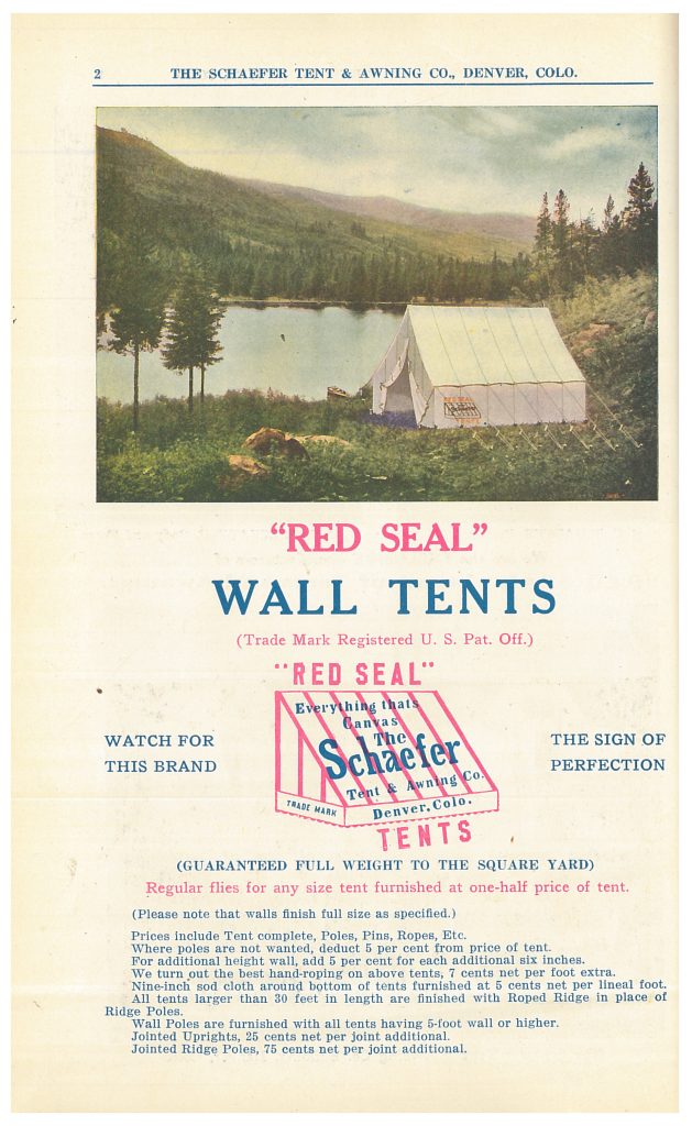 "Red Seal" Wall Tent set up at a campsite near a lake