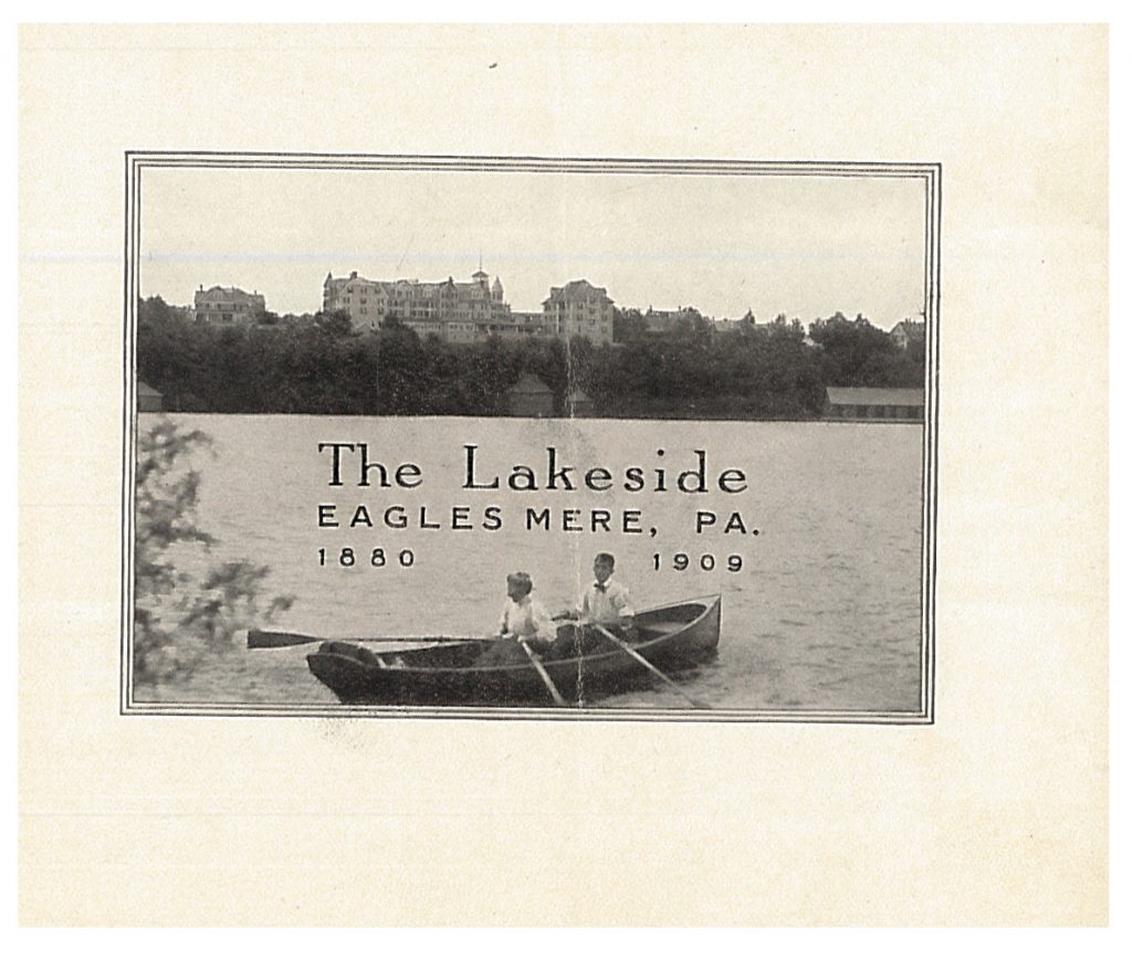 two people on a rowboat with Lakeside in the background