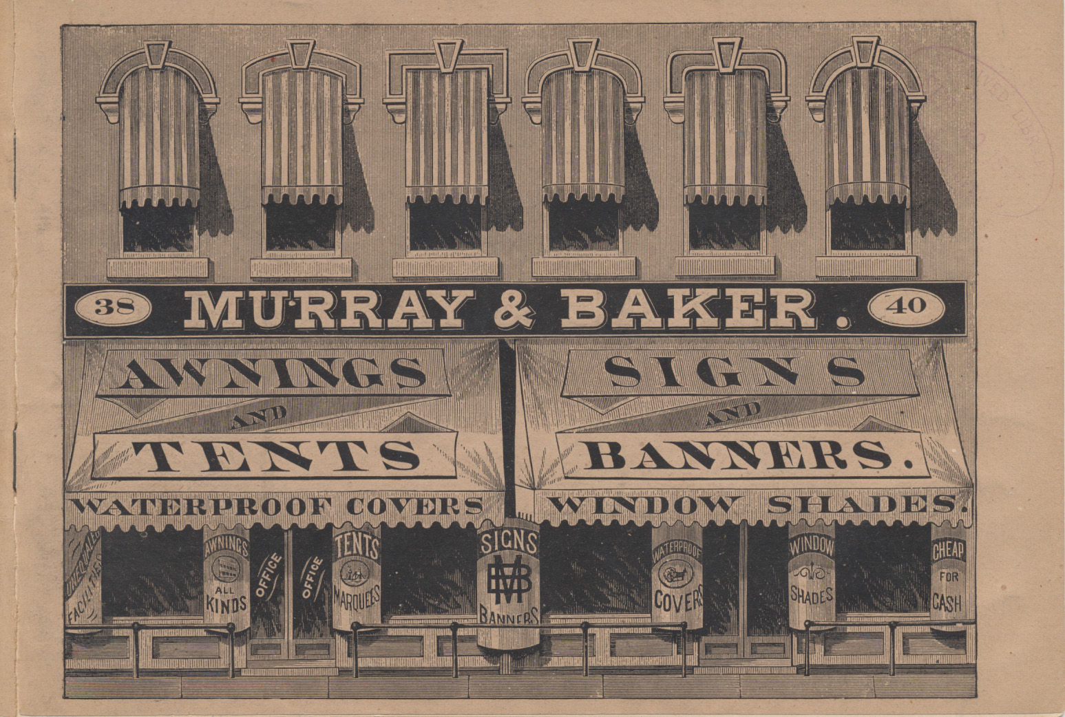 two floor building with awnings over windows and signs on display windows