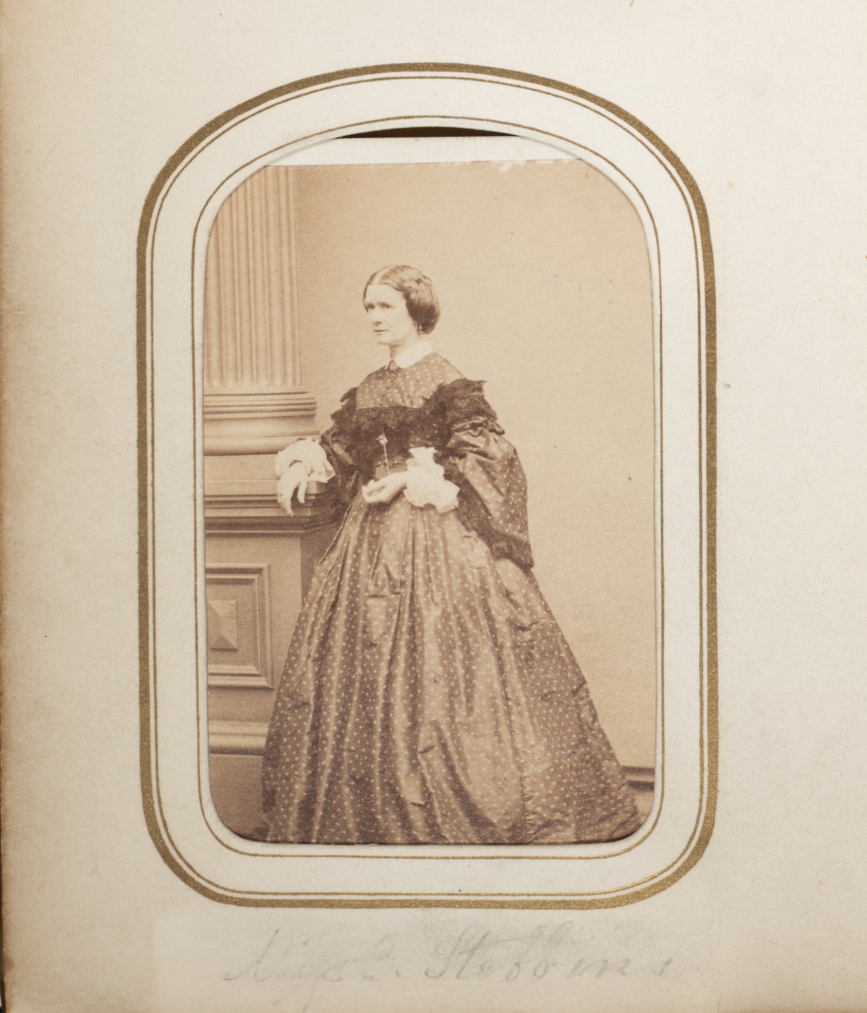 Carte de VIsite of Emma Stebbins. 19th century photography of Caucasian women standing in dark hoop skirt dress.