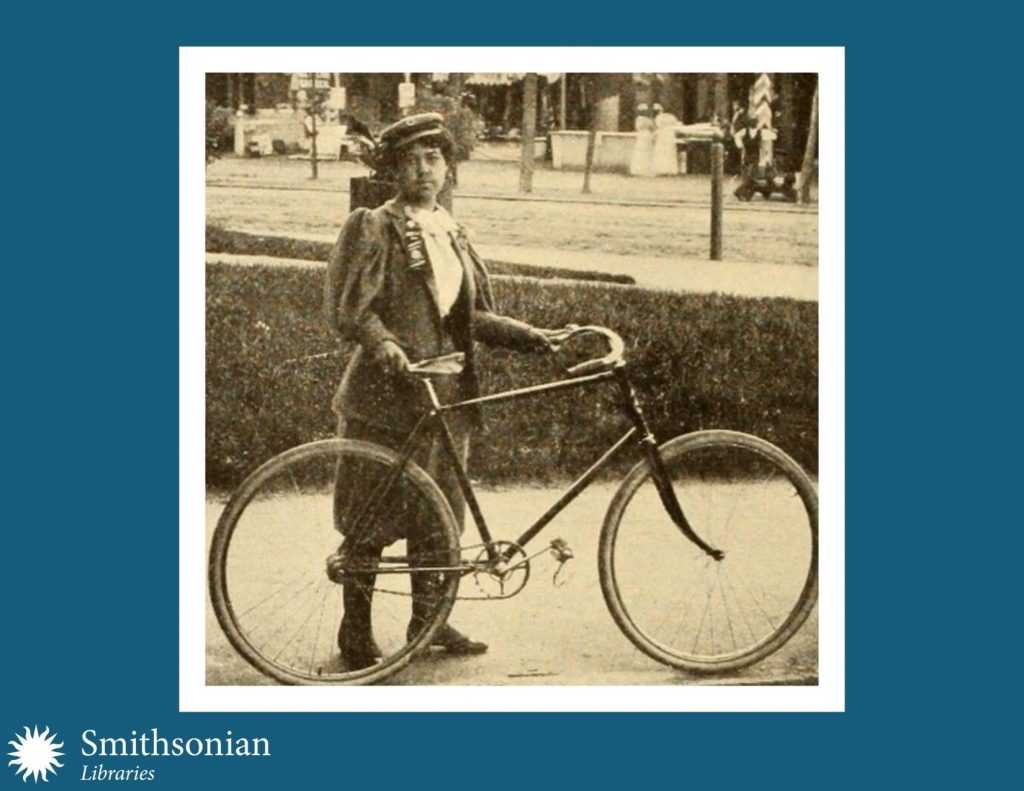 19th century photograph of young woman and bicycle. 