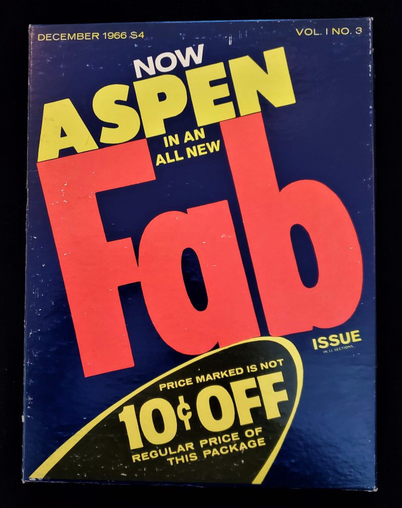 Magazine cover with "Fab" printed in large orange letters in center. Yellow "Aspen" directly above.