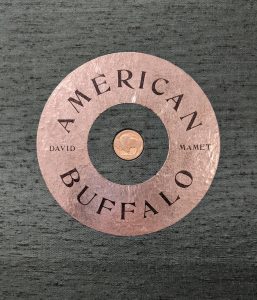 Cover of David Mamet book American Buffalo., with nickel embedded.