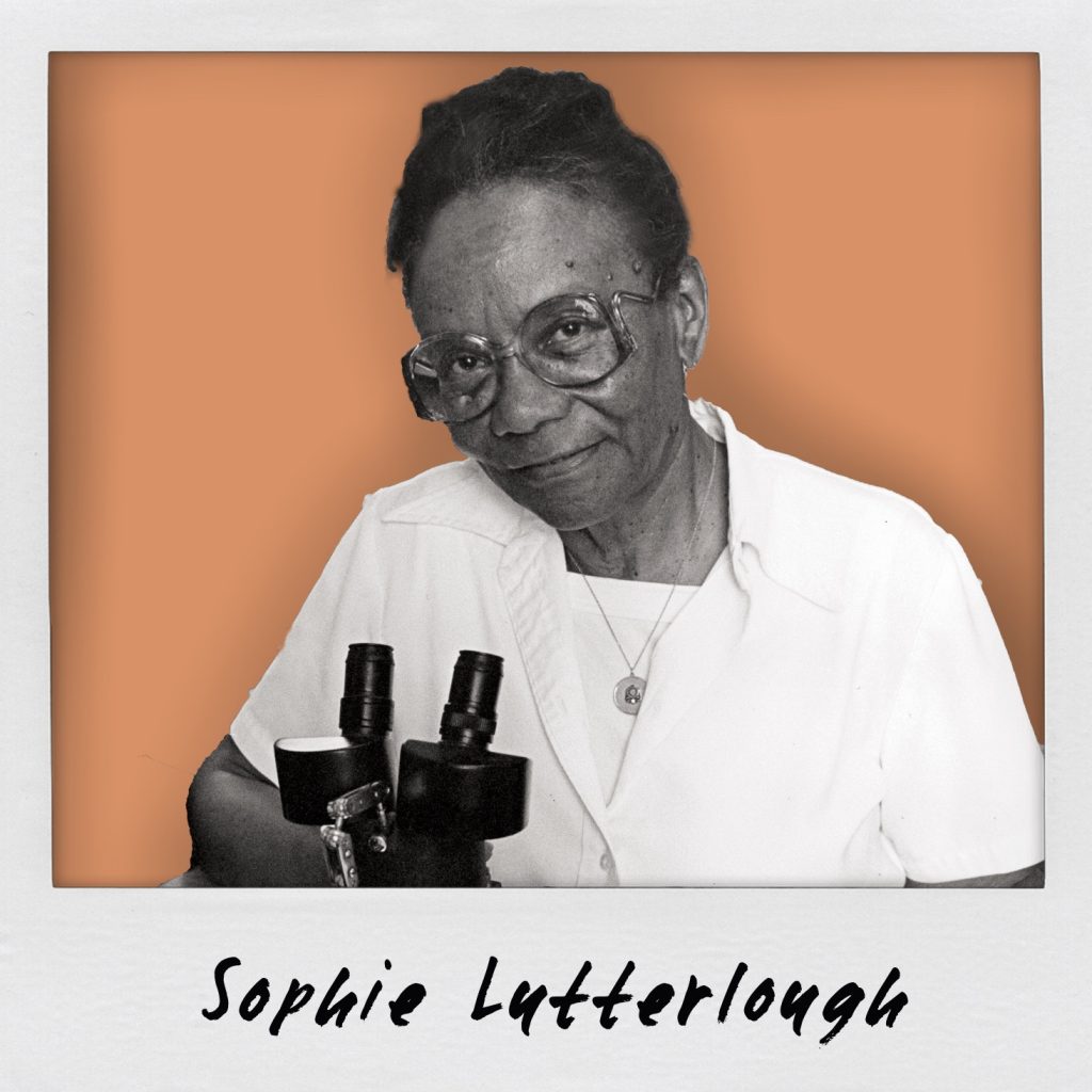 Black and white photo of woman with microscope on orange background. 