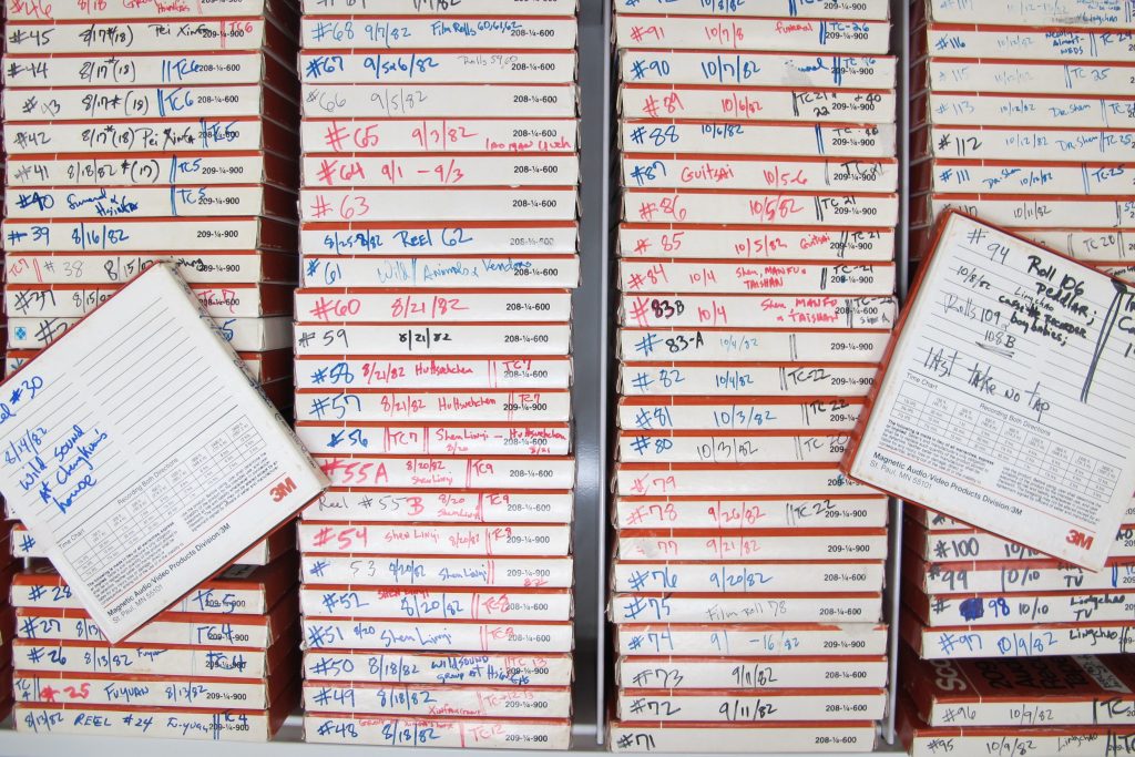 Drawerful of dozens of quarter-inch audiotape boxes containing handwritten labeling.