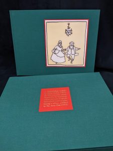 Image of a book with an illustration of dancers and slipcase